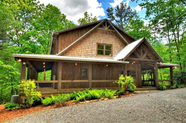 179 Huckleberry Ln, Ellijay, GA 30536 - view of front of home featuring a sunroom and metal roof