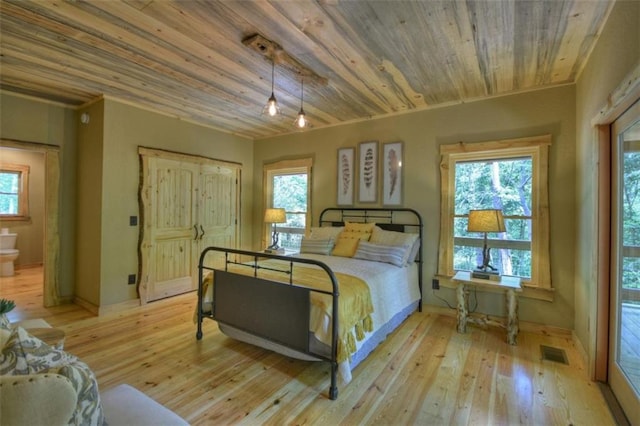 179 Huckleberry Ln, Ellijay, GA 30536 - bedroom featuring multiple windows, wood-type flooring, wooden ceiling, connected bathroom, and baseboards