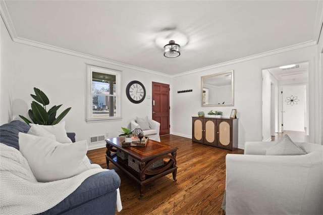 living area featuring visible vents, ornamental molding, and wood finished floors