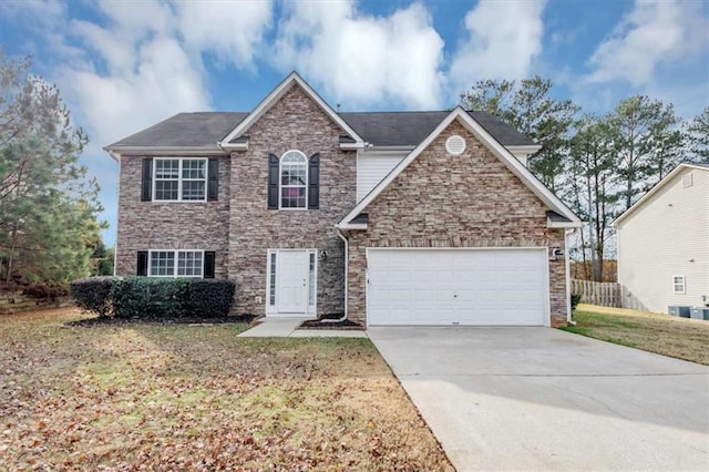 front facade featuring a garage and a front yard