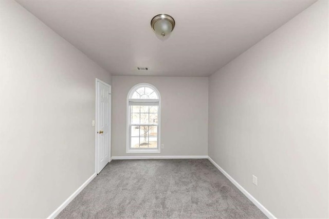 empty room featuring light colored carpet