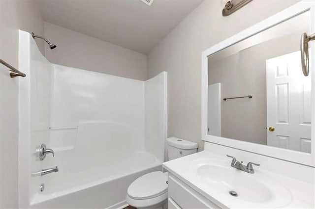 full bathroom featuring vanity, washtub / shower combination, and toilet