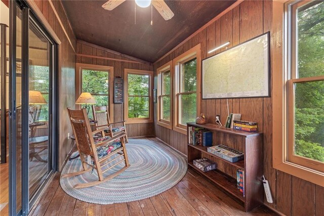 sunroom featuring ceiling fan and vaulted ceiling