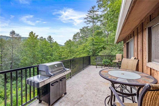 view of patio / terrace featuring grilling area and a balcony