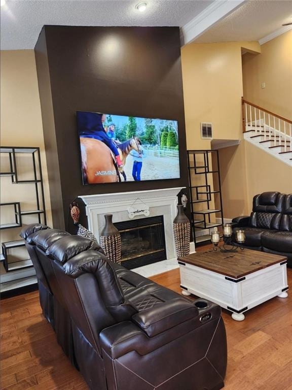 6210 Douglas Manor Ct, Douglasville, GA 30134 - home theater room featuring wood finished floors, a high end fireplace, a textured ceiling, and crown molding