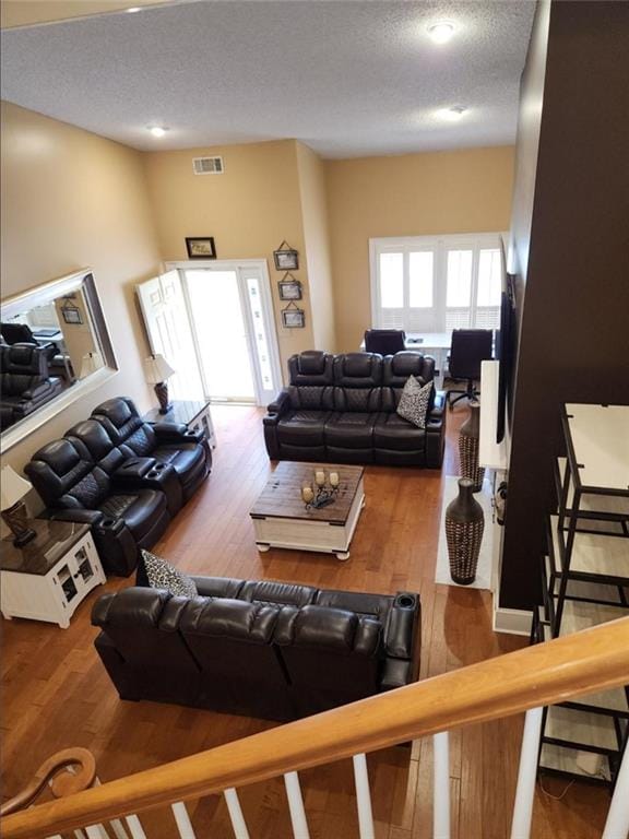 6210 Douglas Manor Ct, Douglasville, GA 30134 - living area featuring a textured ceiling and wood finished floors