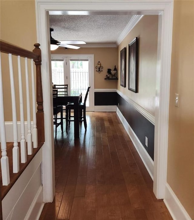 6210 Douglas Manor Ct, Douglasville, GA 30134 - dining space featuring a ceiling fan, dark wood-style flooring, ornamental molding, a textured ceiling, and stairway