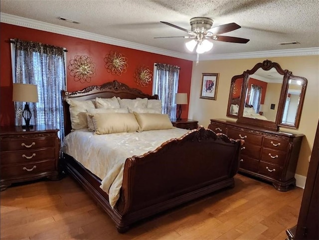 6210 Douglas Manor Ct, Douglasville, GA 30134 - bedroom featuring light wood-type flooring, ornamental molding, a textured ceiling, and a ceiling fan