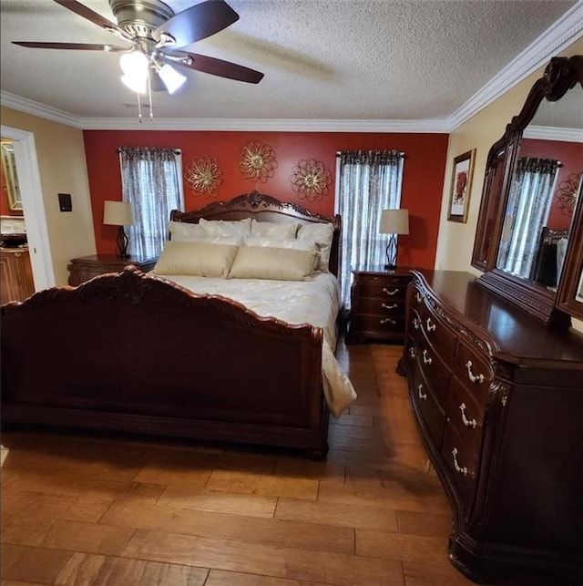 6210 Douglas Manor Ct, Douglasville, GA 30134 - bedroom with light wood-type flooring, ornamental molding, ceiling fan, and a textured ceiling
