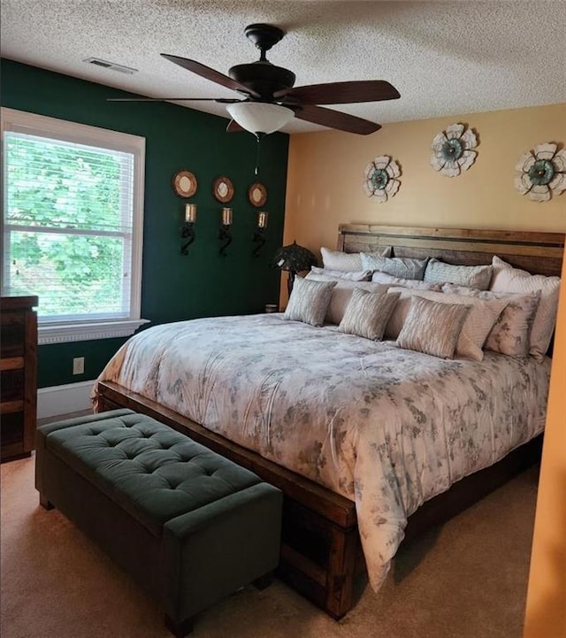 6210 Douglas Manor Ct, Douglasville, GA 30134 - carpeted bedroom with a textured ceiling and a ceiling fan