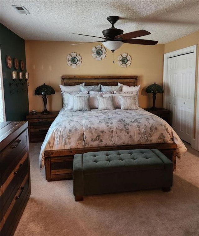 6210 Douglas Manor Ct, Douglasville, GA 30134 - bedroom featuring light colored carpet, a textured ceiling, and ceiling fan