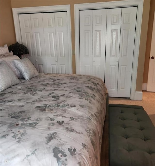 6210 Douglas Manor Ct, Douglasville, GA 30134 - carpeted bedroom with multiple closets and baseboards
