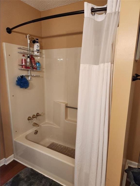 6210 Douglas Manor Ct, Douglasville, GA 30134 - bathroom with shower / tub combo with curtain and wood finished floors