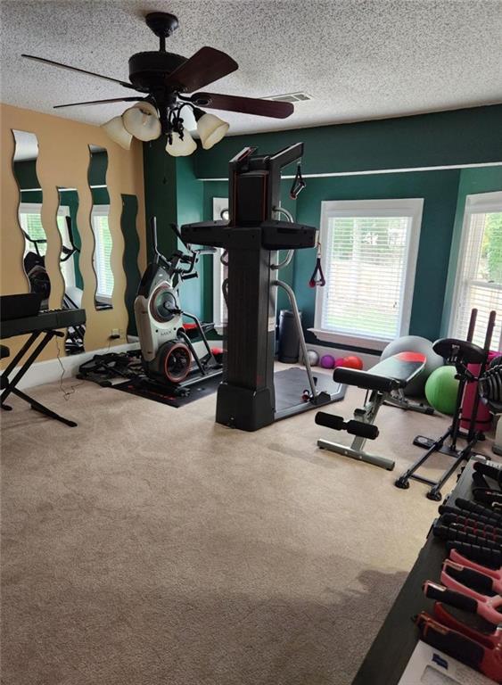 6210 Douglas Manor Ct, Douglasville, GA 30134 - workout room with a textured ceiling, carpet, and ceiling fan