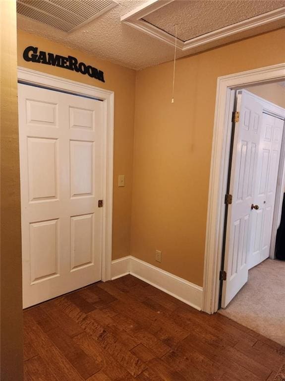 6210 Douglas Manor Ct, Douglasville, GA 30134 - spare room featuring attic access, dark wood-style floors, and baseboards