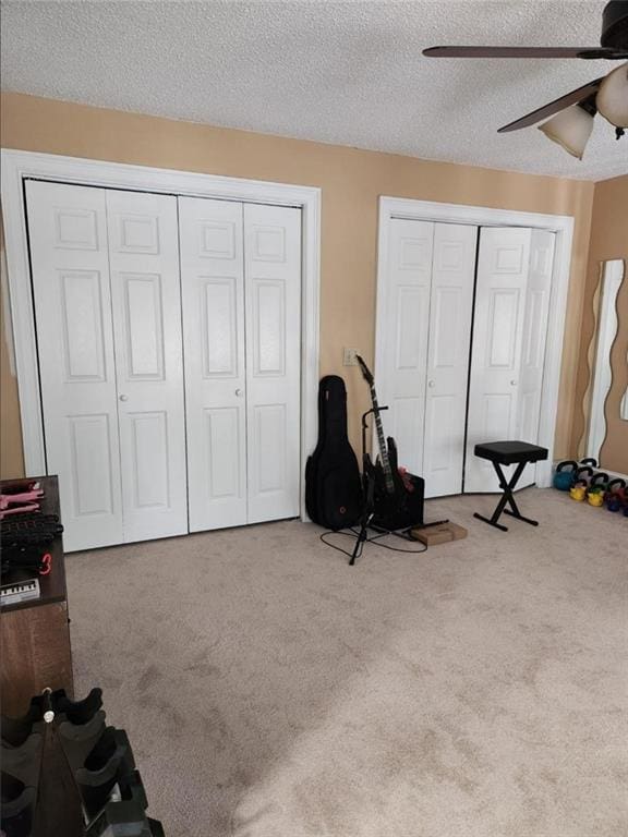 6210 Douglas Manor Ct, Douglasville, GA 30134 - recreation room with a ceiling fan, carpet floors, and a textured ceiling
