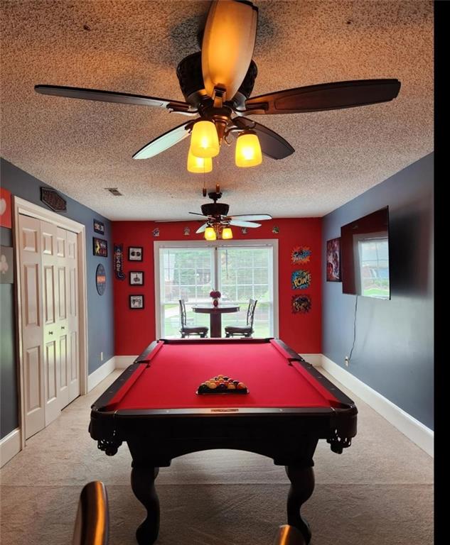 6210 Douglas Manor Ct, Douglasville, GA 30134 - recreation room with carpet, a ceiling fan, a textured ceiling, pool table, and baseboards