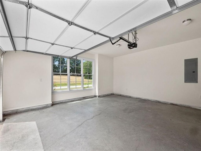 garage with electric panel and a garage door opener