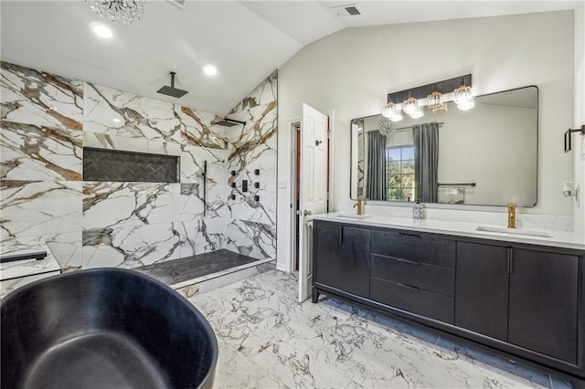 bathroom with marble finish floor, double vanity, visible vents, vaulted ceiling, and a sink