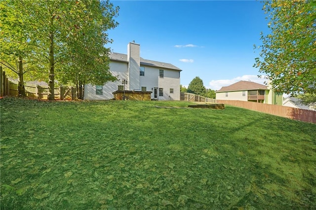 view of yard with a fenced backyard