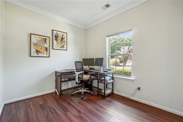 office featuring ornamental molding, wood finished floors, and baseboards