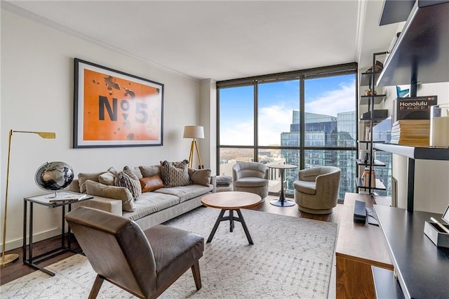 living room featuring floor to ceiling windows and hardwood / wood-style flooring