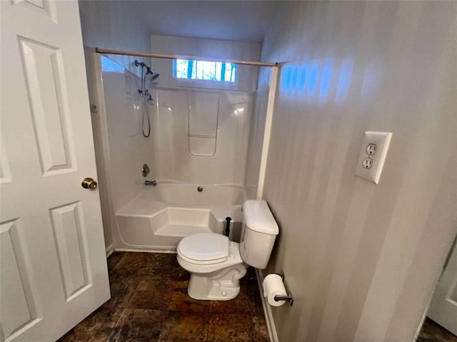 bathroom with toilet and washtub / shower combination