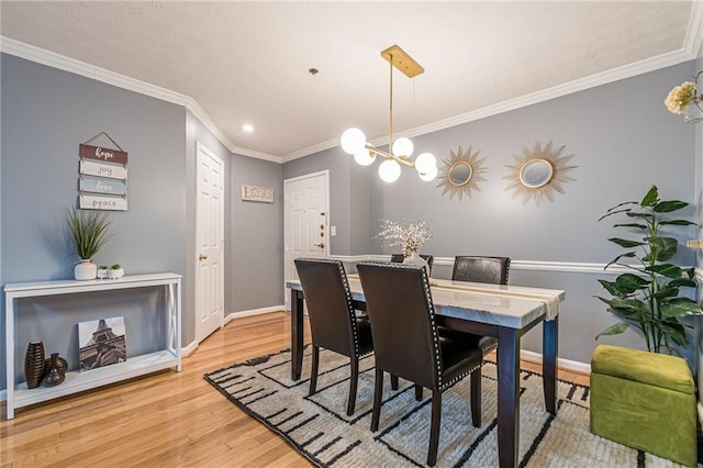 970 Sidney Marcus Blvd Unit 1217, Atlanta, GA 30324 - dining area featuring light wood finished floors, baseboards, crown molding, and an inviting chandelier