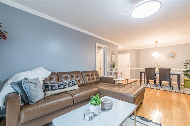 970 Sidney Marcus Blvd Unit 1217, Atlanta, GA 30324 - living room featuring baseboards, ornamental molding, and light wood-style flooring