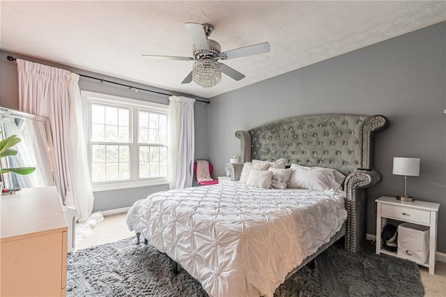 970 Sidney Marcus Blvd Unit 1217, Atlanta, GA 30324 - bedroom featuring light colored carpet, ceiling fan, baseboards, and a textured ceiling