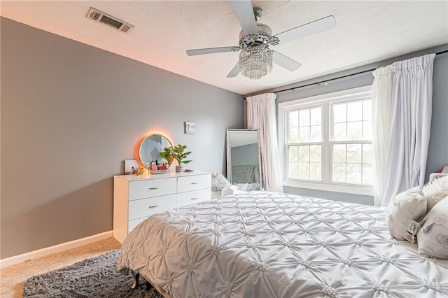 970 Sidney Marcus Blvd Unit 1217, Atlanta, GA 30324 - bedroom with carpet flooring, a ceiling fan, a textured ceiling, baseboards, and visible vents
