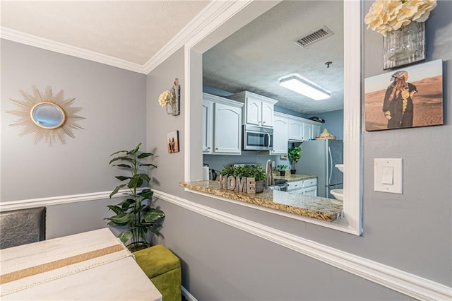 970 Sidney Marcus Blvd Unit 1217, Atlanta, GA 30324 - interior space featuring visible vents, ornamental molding, and a textured ceiling