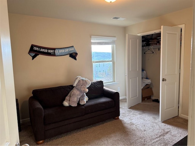 living area featuring carpet flooring