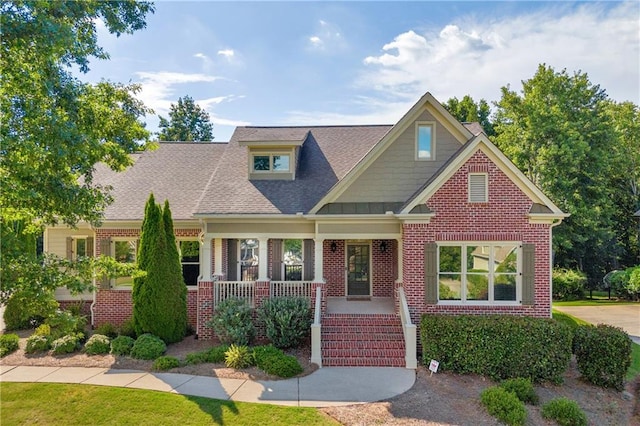 4424 Longmead Rd, Flowery Branch, GA 30542 - view of front of home featuring brick siding, a porch, and roof with shingles
