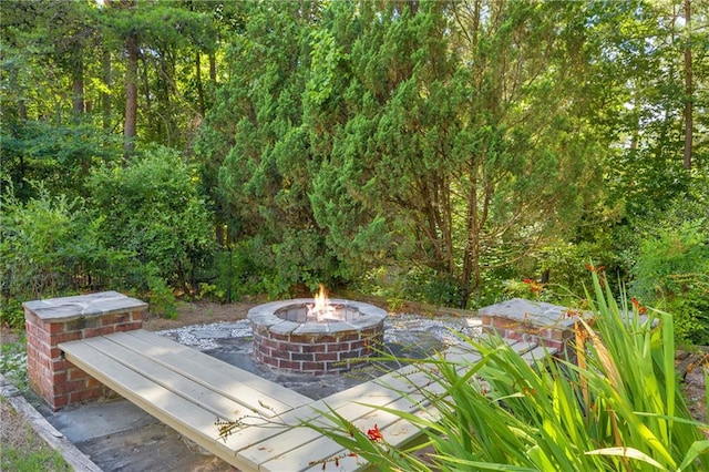 4424 Longmead Rd, Flowery Branch, GA 30542 - view of patio / terrace with an outdoor fire pit
