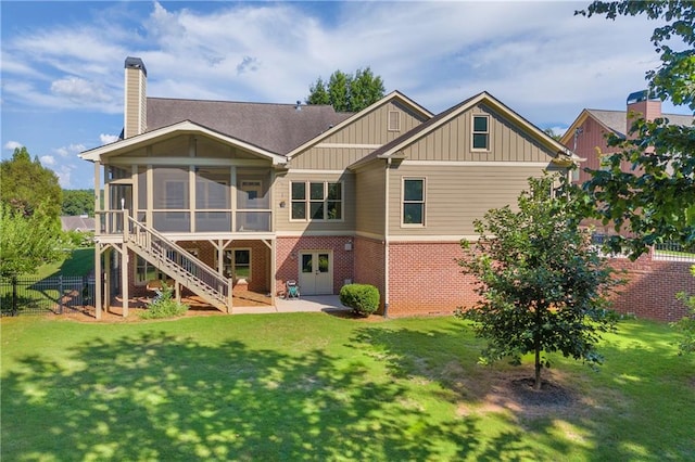 4424 Longmead Rd, Flowery Branch, GA 30542 - rear view of house featuring board and batten siding, brick siding, a sunroom, a patio area, and a chimney