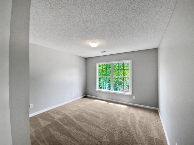 empty room featuring carpet flooring