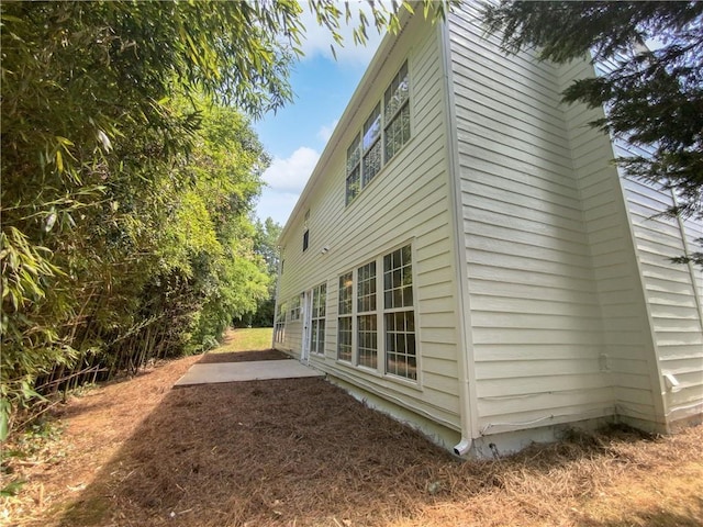 view of home's exterior with a patio