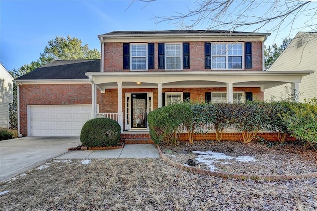 view of front of property with a garage and a porch