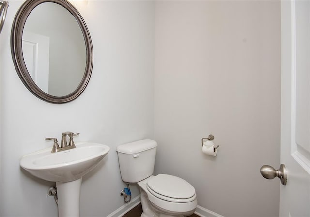 bathroom featuring toilet