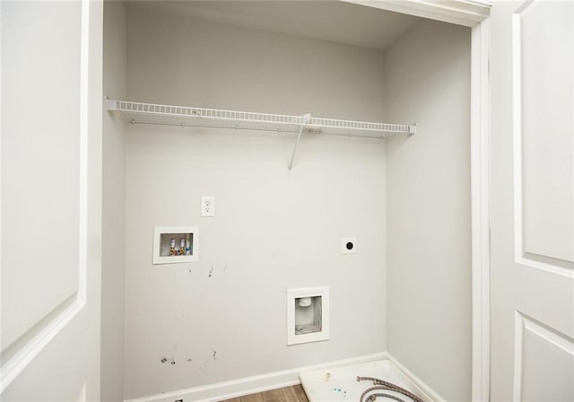 laundry room featuring washer hookup, electric dryer hookup, and wood-type flooring