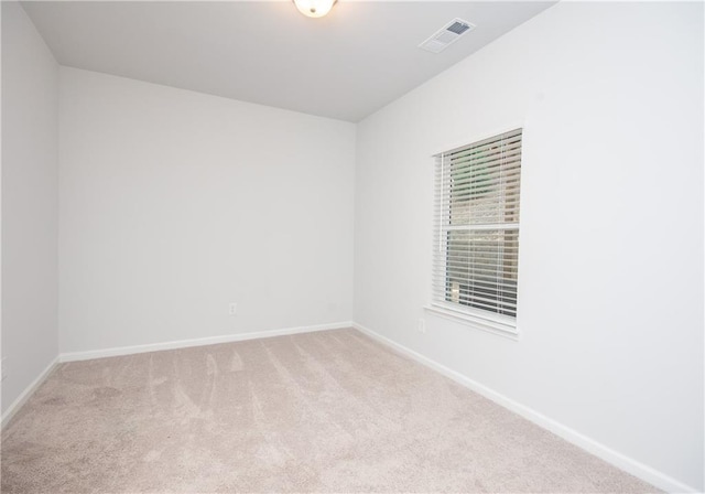 spare room featuring carpet flooring