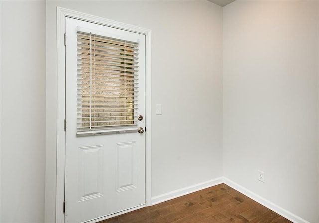 doorway to outside with dark hardwood / wood-style floors