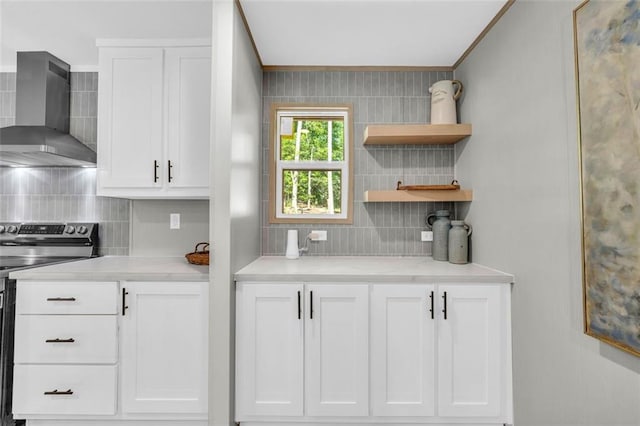 551 Fern Valley Trl, Clarkesville, GA 30523 - kitchen with wall chimney range hood, stainless steel range with electric cooktop, backsplash, light countertops, and white cabinetry