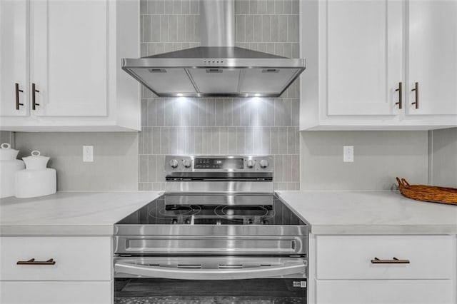 551 Fern Valley Trl, Clarkesville, GA 30523 - kitchen with electric stove, wall chimney range hood, light countertops, and decorative backsplash