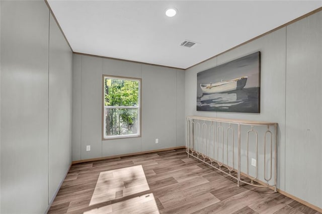 551 Fern Valley Trl, Clarkesville, GA 30523 - spare room with wood finished floors, a decorative wall, and crown molding