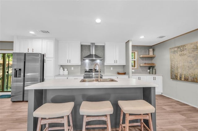 551 Fern Valley Trl, Clarkesville, GA 30523 - kitchen featuring wall chimney range hood, stainless steel appliances, a sink, open shelves, and light countertops