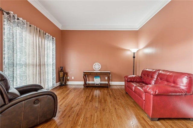 living room with hardwood / wood-style flooring and ornamental molding