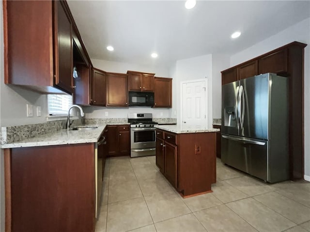 200 Pine Trl, Dallas, GA 30157 - kitchen with black appliances, a sink, a center island, light tile patterned flooring, and recessed lighting