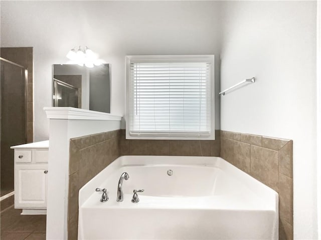 200 Pine Trl, Dallas, GA 30157 - full bathroom with a garden tub, a stall shower, vanity, and tile patterned floors